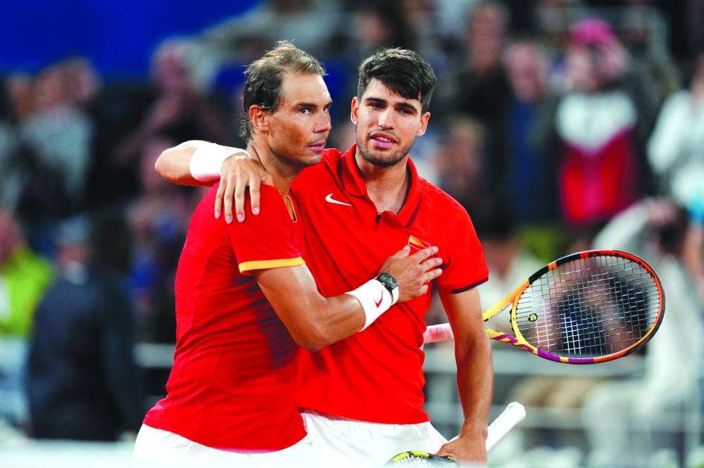 Spain’s Rafael Nadal (left) and Carlos Alcaraz celebrate after winning their first round doubles match against Maximo Gonzalez and Andres Molteni of Argentina at the Paris Olympics. (Reuters) 
