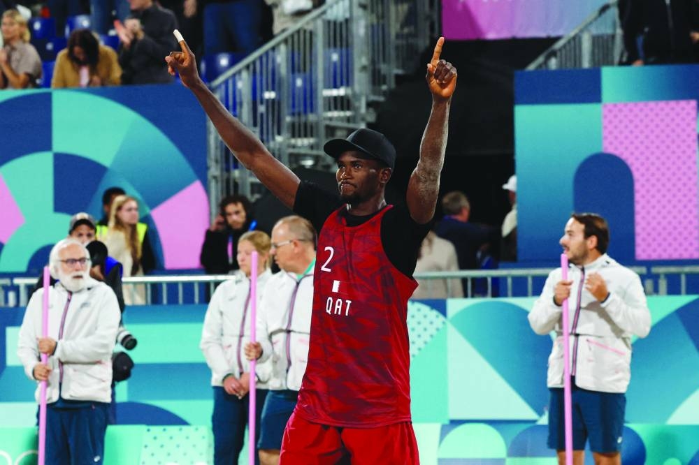 Ahmed Tijan of Qatar celebrates after the game. (Reuters) 
