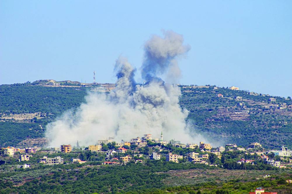 Smoke billows following an Israeli airstrike in the southern Lebanese border village of Chihine, yesterday.