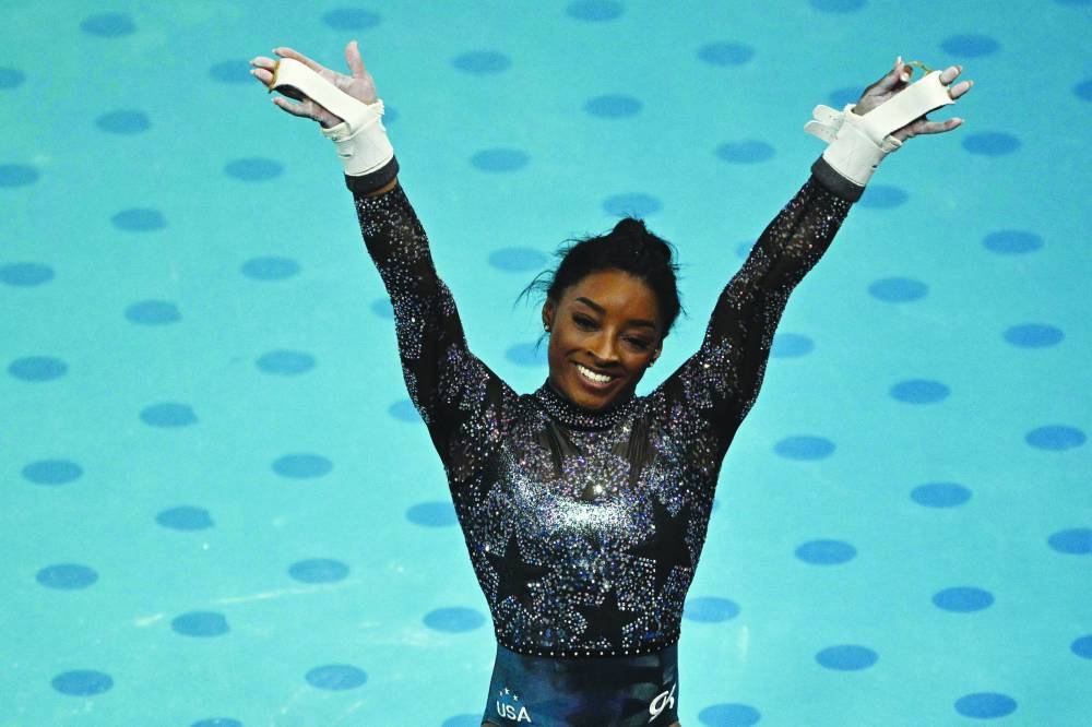 Simone Biles of the US reacts after competing in the uneven bars event of the artistic gymnastics women’s qualification during the Paris 2024 Olympic Games at the Bercy Arena in Paris yesterday. (AFP)