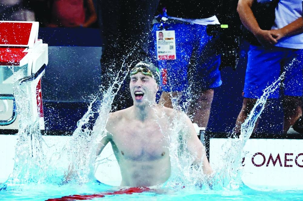 Daniel Wiffen of Ireland celebrates after breaking the Olympic record to win the men’s 800m freestyle gold at the Paris La Defense Arena in Nanterre, France. (Reuters) 