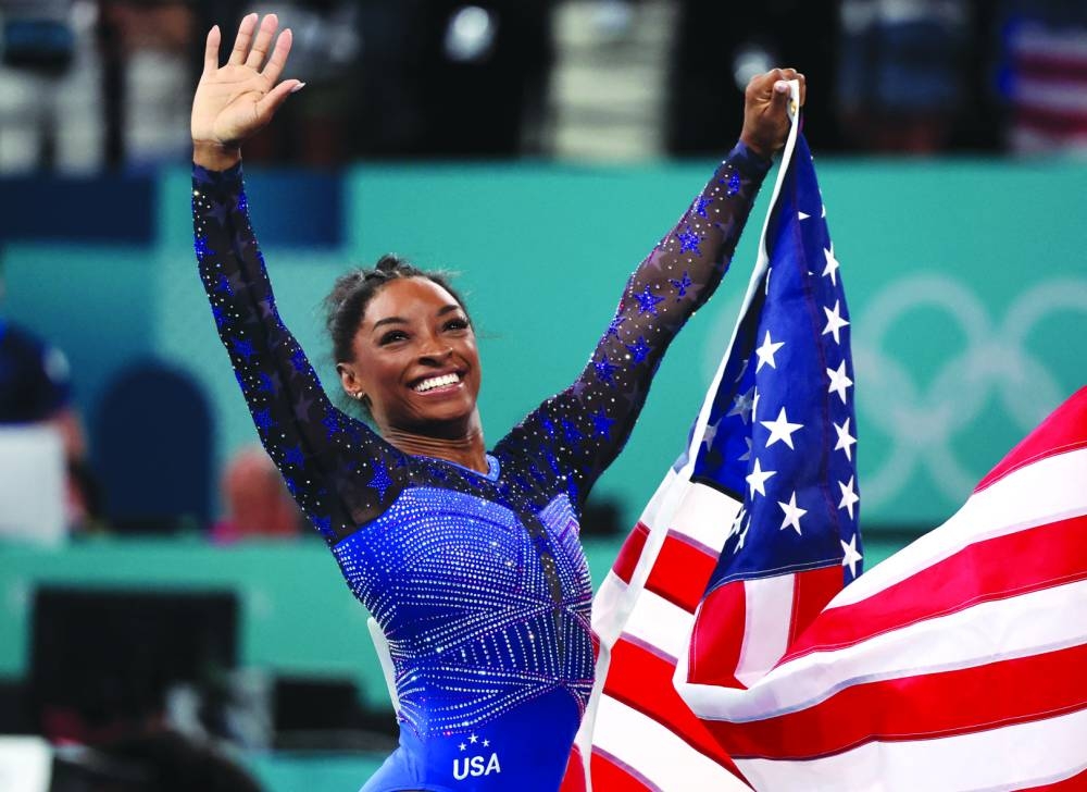 
Simone Biles of United States celebrates after winning gold in the gymnastics all-around final at the Paris Olympic Games on Thursday. (Reuters) 