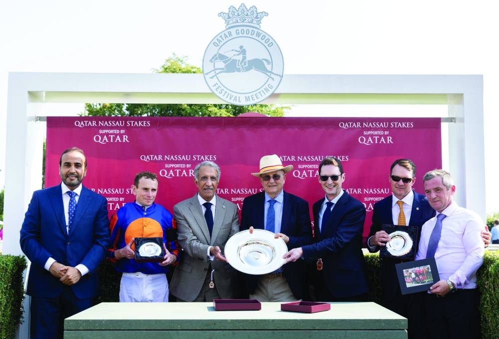 Ambassador of Qatar to UK Sheikh Abdullah bin Mohamed bin Saoud al-Thani and QREC Chairman Issa bin Mohamed al-Mohannadi with the connections of Opera Singer, which won the Qatar Nassau Stakes at the Qatar Goodwood Festival on Thursday. 