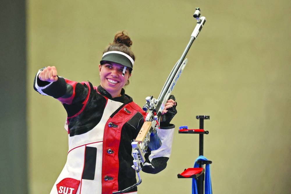 Switzerland’s Chiara Leone celebrates winning the 50 Rifle 3 Positions women’s final during the Paris 2024 Olympic Games at Chateauroux Shooting Centre on Friday. (AFP)