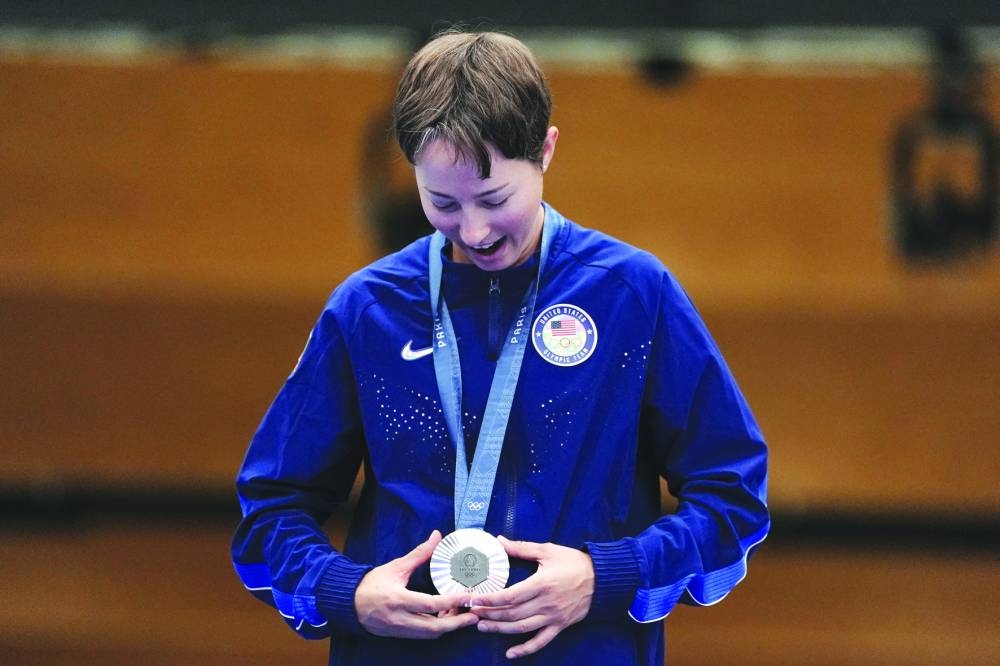 Silver medallist Sagen Maddalena of the US looks at her silver medal at the Paris Olympic Games on Friday. (Reuters)