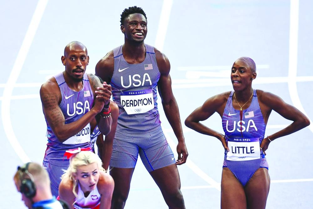 US athletes celebrate after their world record in the mixed 4x400m relay heat. (AFP) 