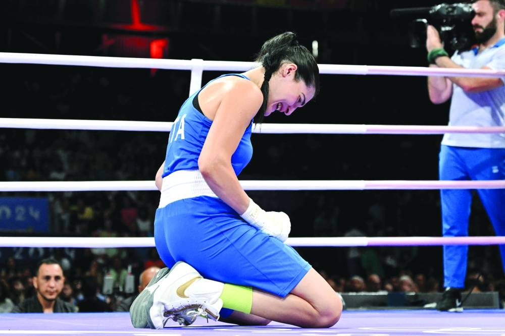 Italy's Angela Carini reacts during her women's 66kg preliminaries round of 16 boxing match against Algeria's Imane Khelif during the Paris 2024 Olympic Games at the North Paris Arena, in Villepinte on August 1, 2024. (AFP)