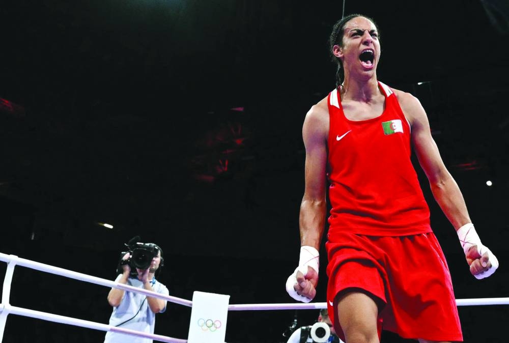 Algeria’s Imane Khelif celebrates her victory over Hungary’s Anna Luca Hamori in the women’s 66kg quarter-final during the Paris 2024 Olympic Games at the North Paris Arena in Villepinte on Saturday. (AFP) 