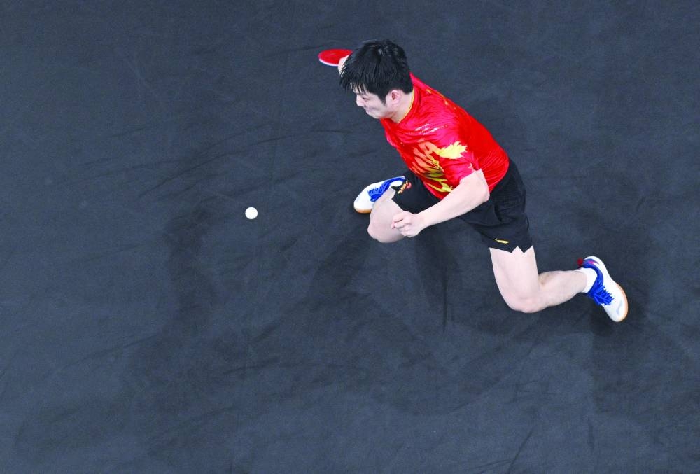 
Fan Zhendong of China in action during his gold medal match against Truls Moregard of Sweden in the men’s singles final at the Paris 2024 Olympics in South Paris Arena 4 in Paris, yesterday. (Reuters) 