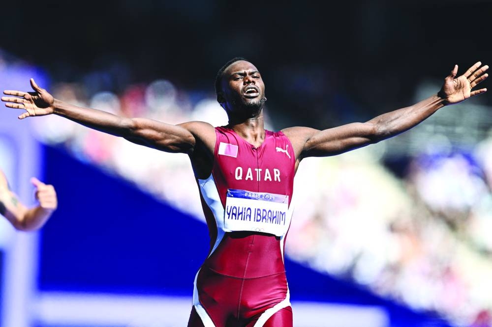 Qatar’s Ammar Ismail reacts after winning the 400m repechage round. 