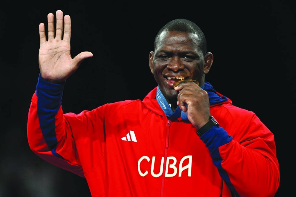 Greco-Roman 130kg gold medallist Cuba’s Mijain Lopez Nunez poses with his medal on Tuesday. (AFP) 