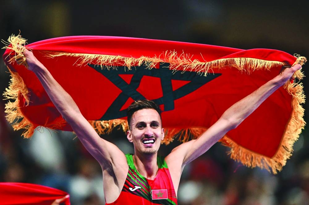 
Morocco’s Soufiane El Bakkali celebrates after winning the men’s 3000m steeplechase final at the Paris 2024 Olympic Games in Saint-Denis, north of Paris, on Wednesday. (AFP) 