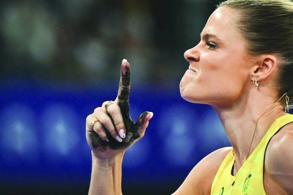 
Australia’s Nina Kennedy celebrates after winning the women’s pole vault final on Wednesday. (AFP) 