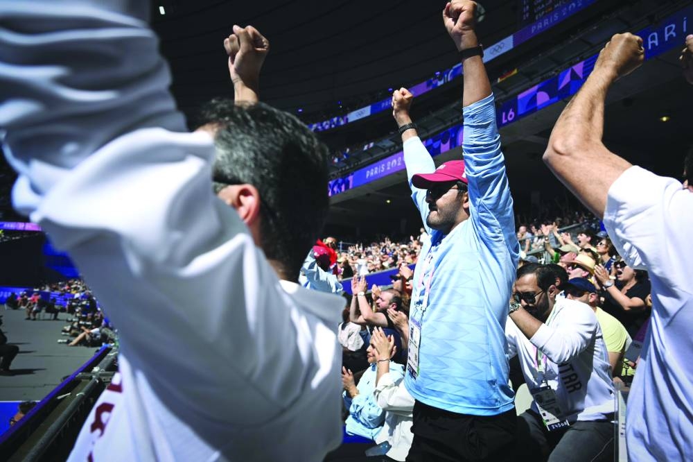 Qatar Olympic Committee President HE Sheikh Joaan bin Hamad al-Thani celebrates after Mutaz Barshim qualified for the high jump final in Paris. 
