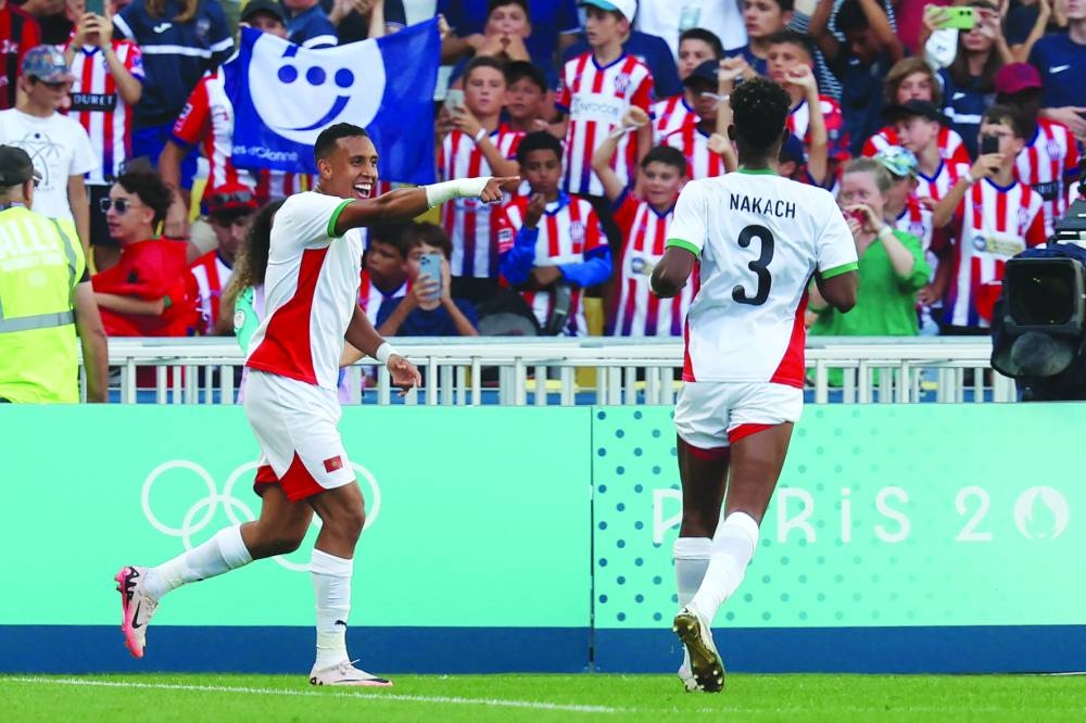 Morocco’s forward Soufiane Rahimi celebrates scoring his team’s third goal in the bronze medal football match against Egypt during the Paris 2024 Olympic Games at the La Beaujoire Stadium in Nantes on Thursday. (AFP)