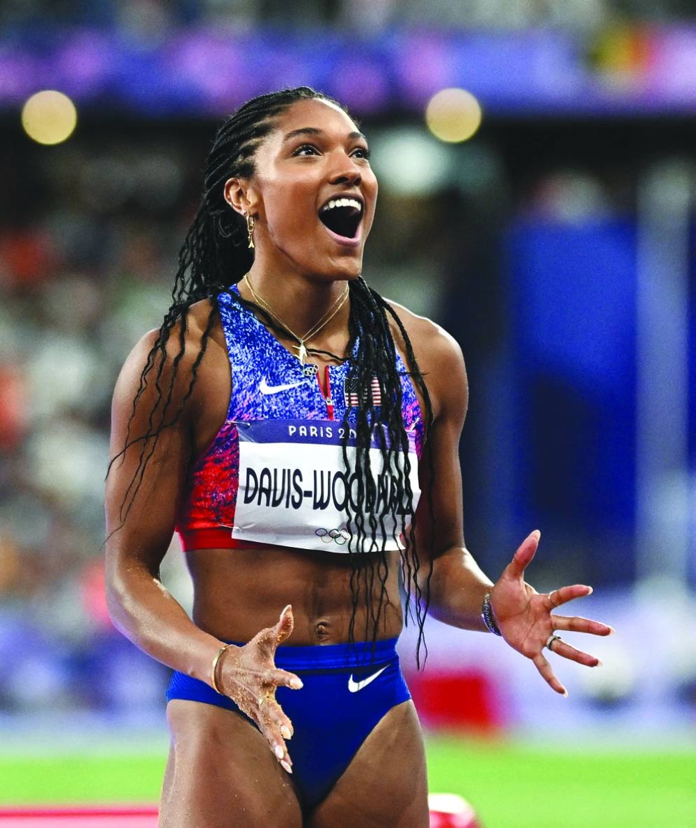 Tara Davis-Woodhall of United States celebrates after winning long jump gold. (Reuters) 