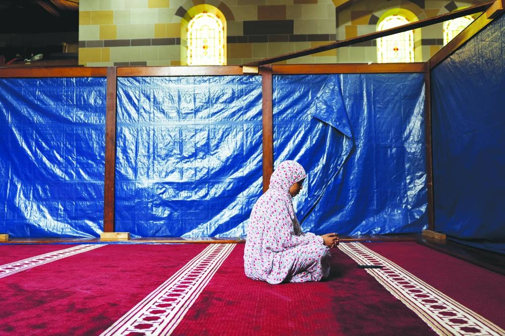A Muslim worshipper attends Friday prayers at Iqraa Dunmurry Mosque in Belfast, Northern Ireland.