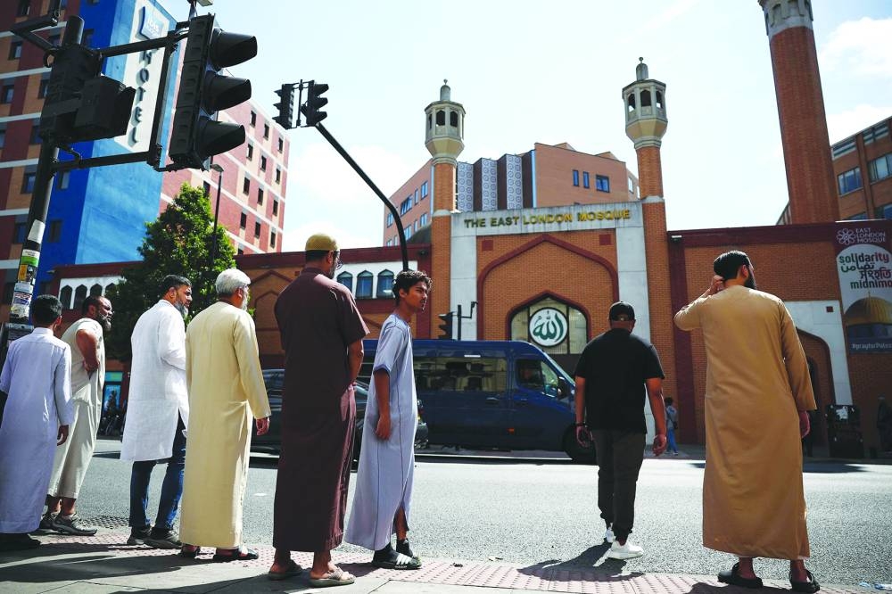 Worshippers outside the East London Mosque in Tower Hamlets, London.