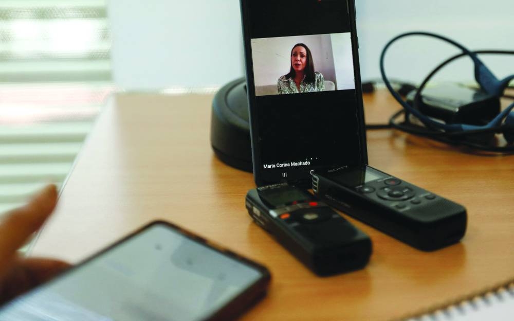 Venezuela's opposition leader Maria Corina Machado is seen on a mobile phone screen during a press conference with Mexican media via Zoom, in Caracas. – Reuters