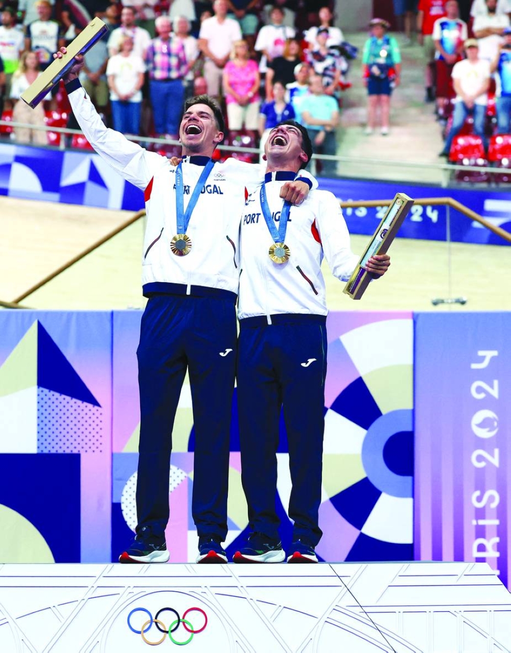 Gold medallists Iuri Leitao of Portugal and Rui Oliveira celebrate on the podium of men’s madison on Saturday. (Reuters)