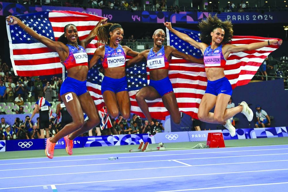 From left: United States’ Alexis Holmes, Gabrielle Thomas, Shamier little and Sydney Mclaughlin-Levrone celebrate after winning the women’s 4x400m relay gold. 