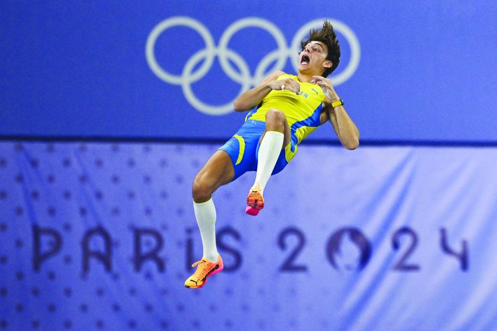 
Sweden’s Armand Duplantis passes 6.25m and sets the new world record in the men’s pole vault final at the Paris 2024 Olympic Games at Stade de France in Saint-Denis on August 5, 2024. (AFP) 