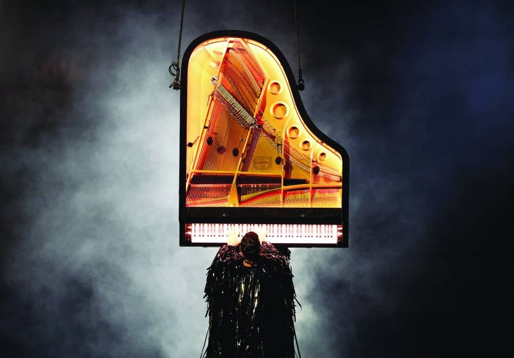 
Pianist Alain Roche plays during the closing ceremony. (Reuters) 