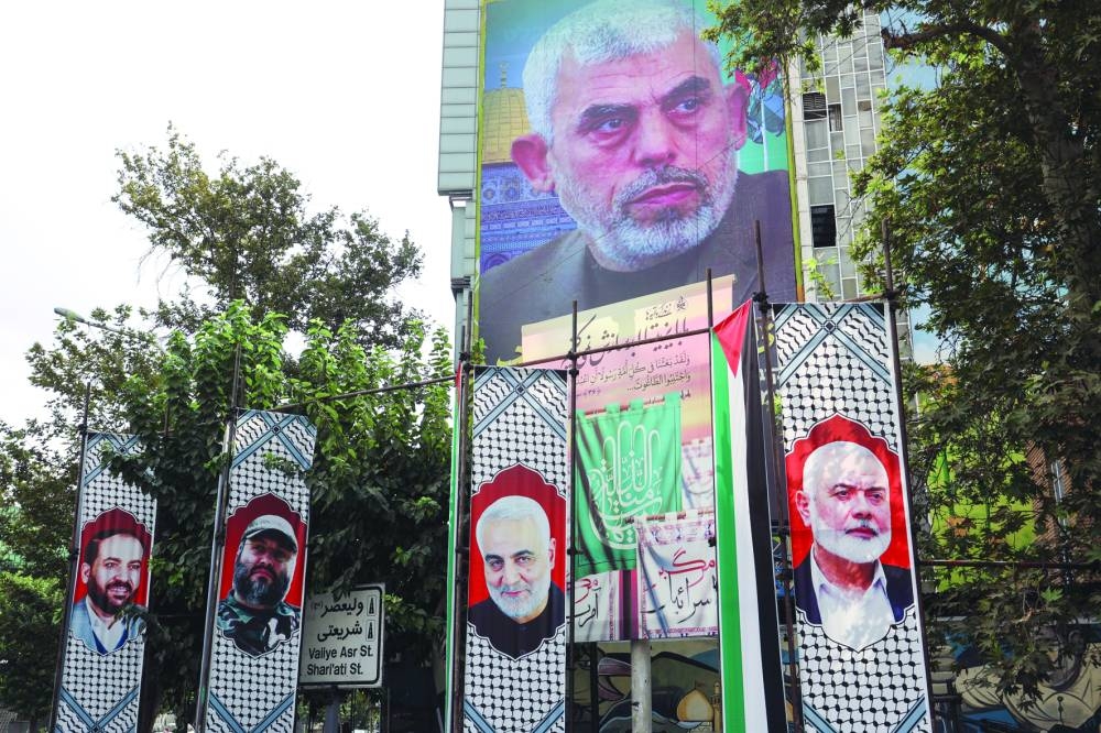 A billboard with a picture of newly appointed Hamas leader Yahya Sinwar is displayed on a building in a street in Tehran, Iran, Monday.
