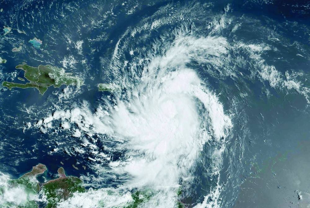 This satellite image obtained from the NOAA shows Tropical Storm Ernesto at 1310 GMT yesterday. – AFP