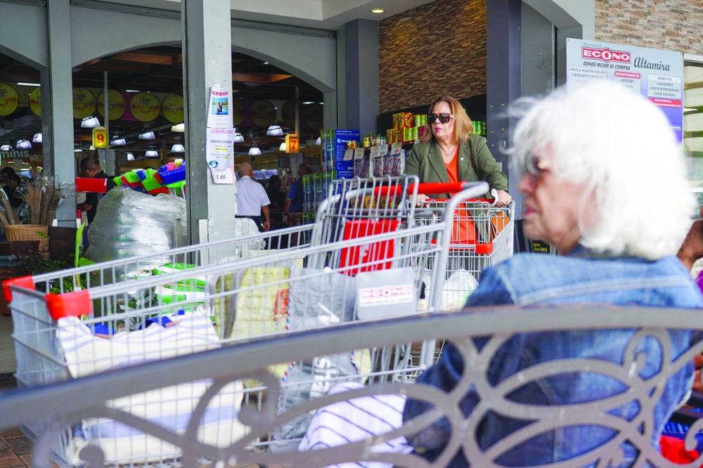 People shop groceries at a supermarket in Guaynabo, Puerto Rico, as they prepare for the arrival of Tropical Storm Ernesto, in San Juan. – AFP