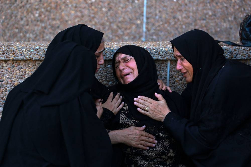 A Palestinian woman mourns a family member killed in Israeli bombardment, at the Nasser hospital in Khan Yunis in the southern Gaza Strip on Wednesday. AFP