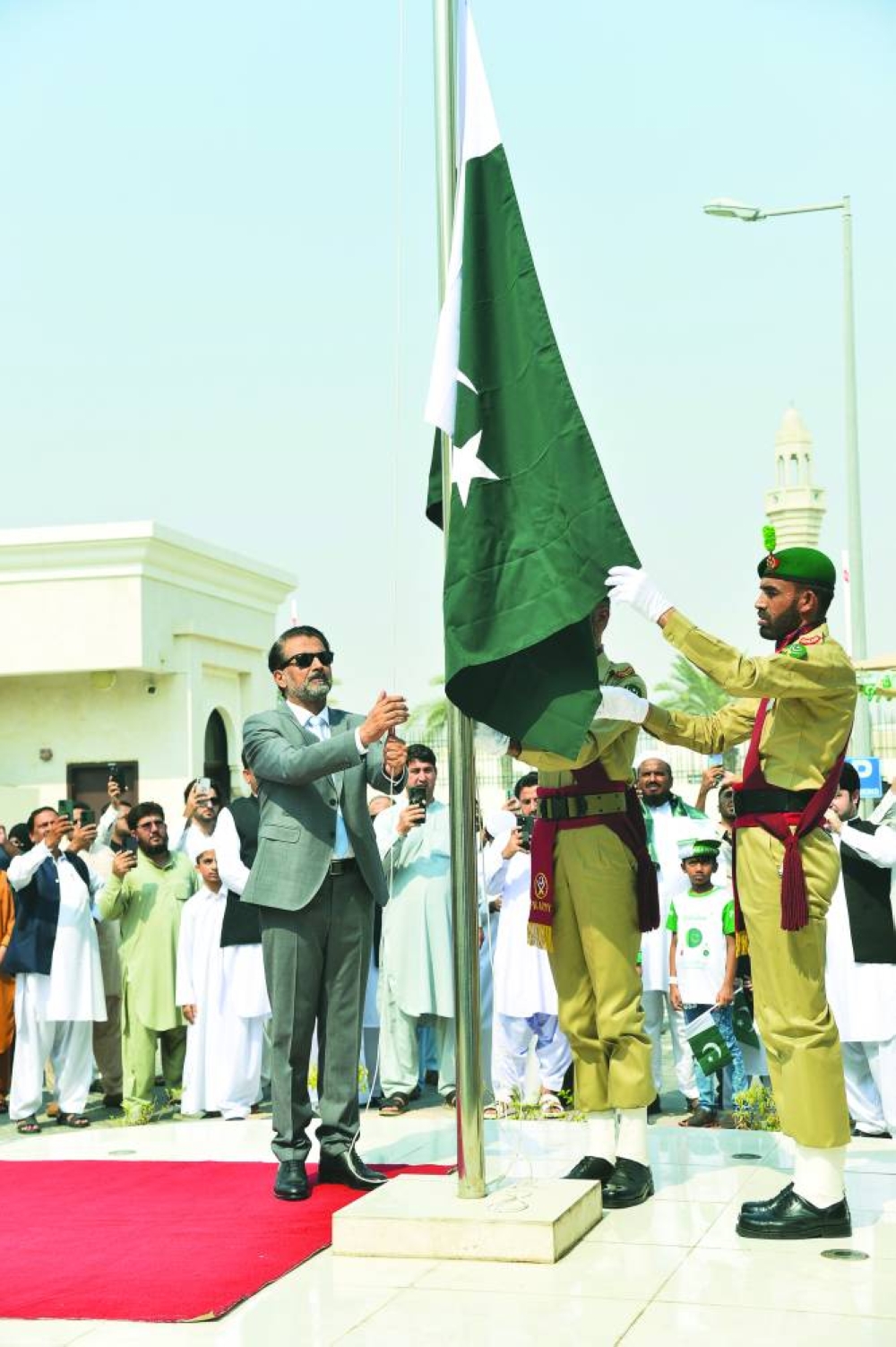 Ambassador Muhemmed Aejaz hoists the Pakistan flag on the embassy premises Wednesday. PICTURES: Shaji Kayamkulam.