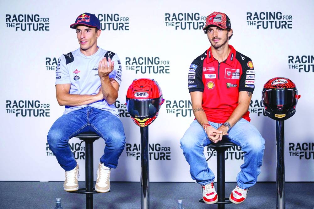Gresini Racing MotoGP Spanish rider Marc Marquez (left) and Ducati Lenovo Team Italian rider Francesco Bagnaia attend a press conference at the Red Bull Ring in Spielberg, Austria, on Thursday, ahead of the Austrian MotoGP Grand Prix weekend. (AFP) 