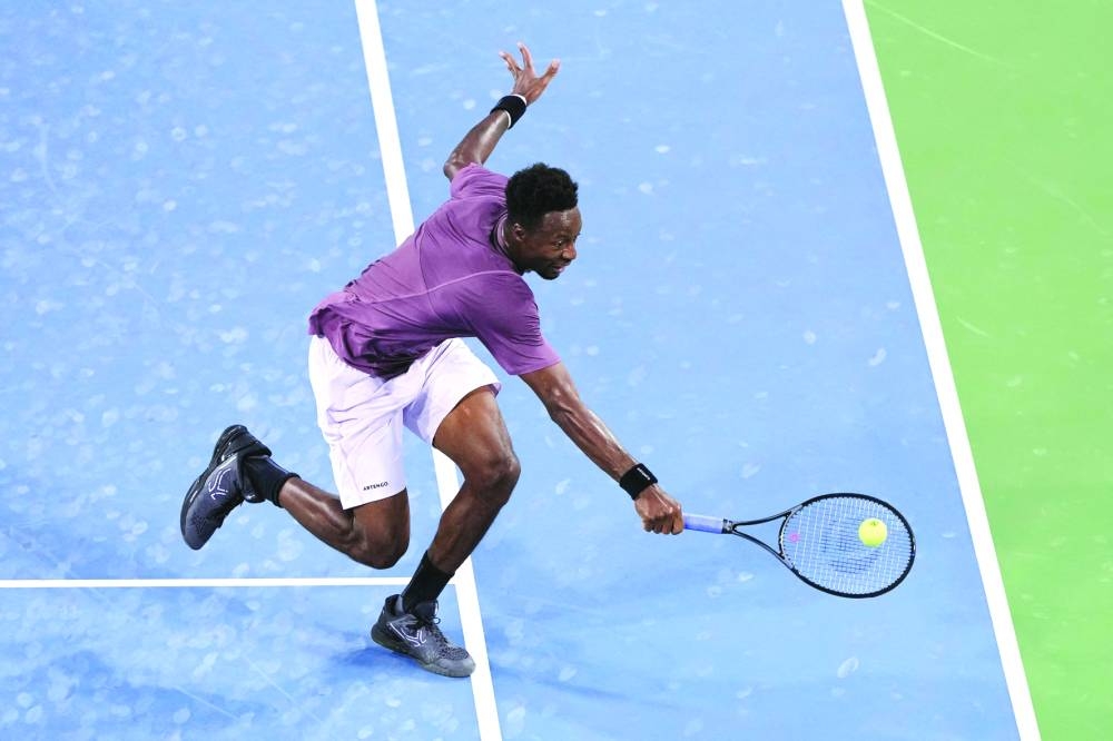 Gael Monfils of France plays a backhand during his match against Carlos Alcaraz of Spain at the Cincinnati Open in Mason, Ohio, on Friday. (AFP)