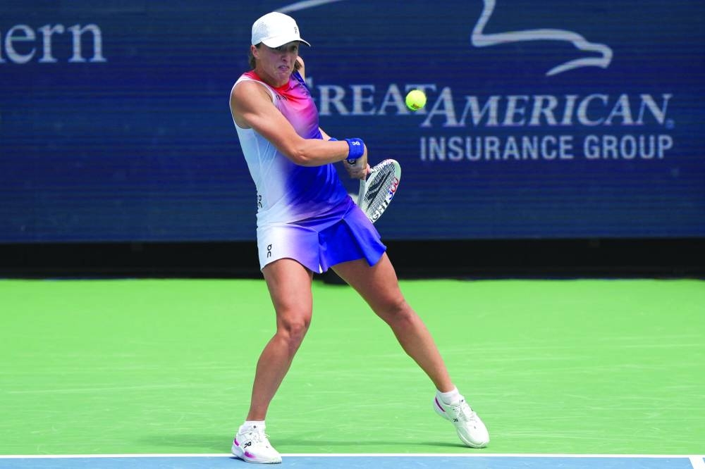 Women’s top seed Iga Swiatek of Poland beat Marta Kostyuk of Ukraine 6-2, 6-2. 