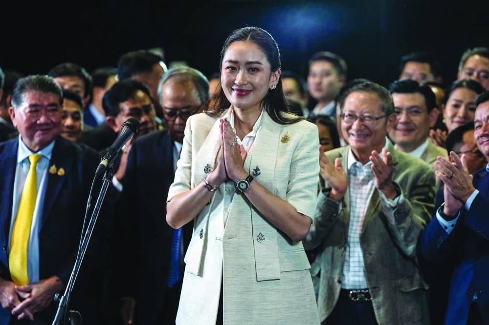 Thailand’s new Prime Minister Paetongtarn Shinawatra, known by her nickname “Ung Ing” and daughter of former prime minister Thaksin Shinawatra, gestures during a press conference in Bangkok. 