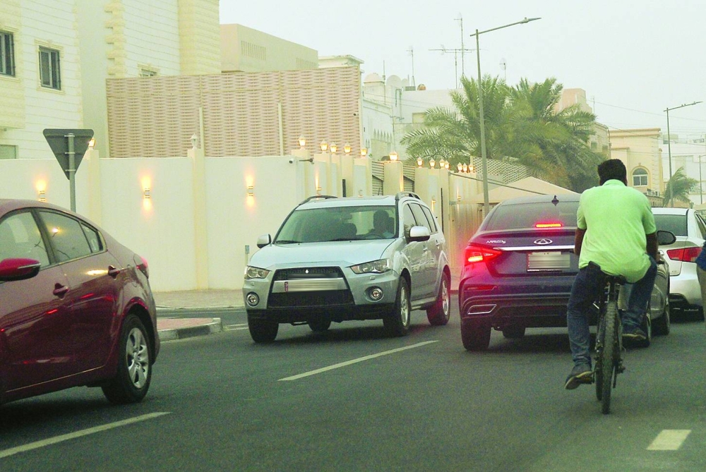An errant cyclist seen on a busy street in Doha. PICTURES: Shaji Kayamkulam