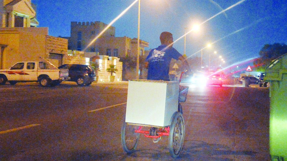A tricycle and rider without safety gear.