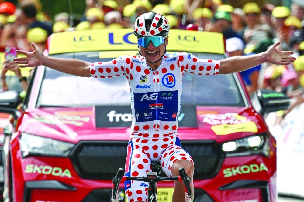 AG Insurance-Soudal team’s Belgian rider Justine Ghekiere reacts after winning the 7th stage of the third edition of the Women’s Tour de France, a 166.4km race between Champagnole and Le Grand-Bornand, on Saturday. (AFP)