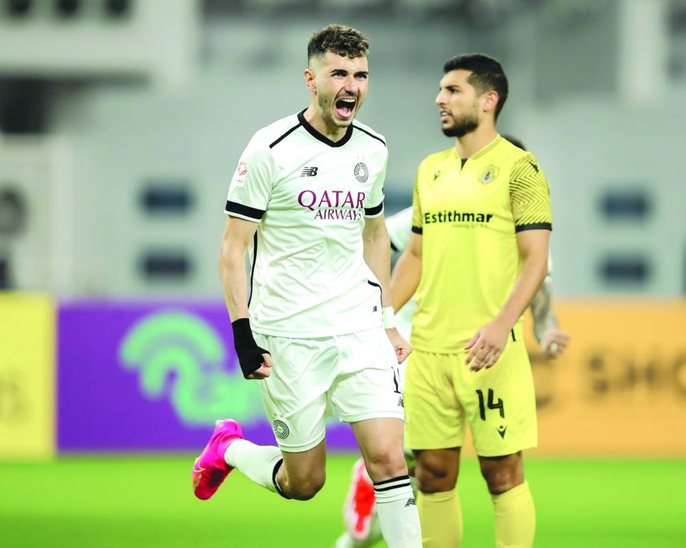 Al Sadd’s Rafael Mujica celebrates after scoring against Qatar SC during the Ooredoo Stars League at the Khalifa International Stadium. 