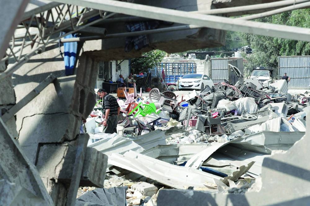 A man inspects the damage to a building after an Israeli strike in the southern town of Kfour, in the Nabatiyeh district, yesterday.