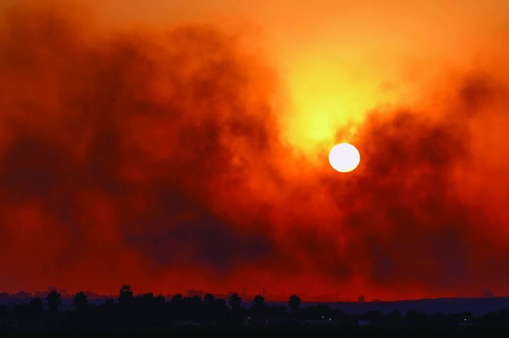 Smoke rises from Gaza after an explosion, as seen from the Israel border, on Sunday 