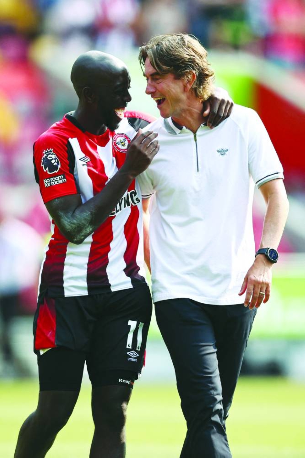 Brentford’s striker Yoane Wissa (left) and coach Thomas Frank share a joke after the English Premier League match against Crystal Palace at the Gtech Community Stadium in London yesterday. (AFP)