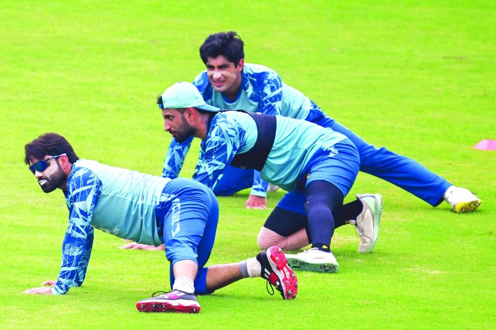 Pakistan's Mohammad Rizwan (left), captain Shan Masood (centre) and Naseem Shah attend training session at the Rawalpindi Cricket Stadium in Rawalpindi ahead of their first Test against Bangladesh. (AFP)
