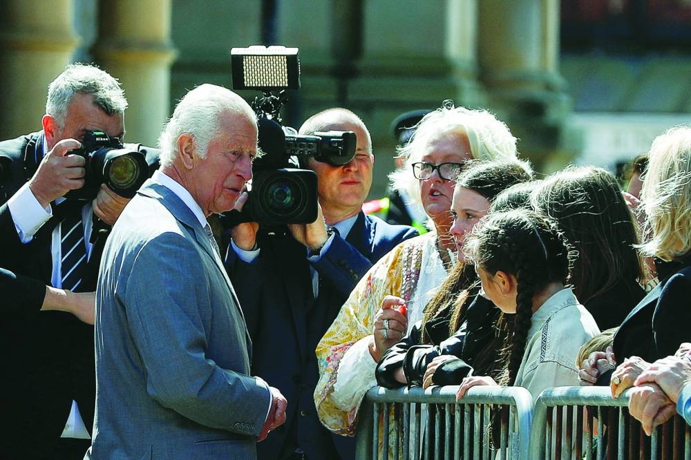 
Britain’s King Charles meets with people affected by and family members of the victims of a mass stabbing attack, during a community visit, in Southport. 