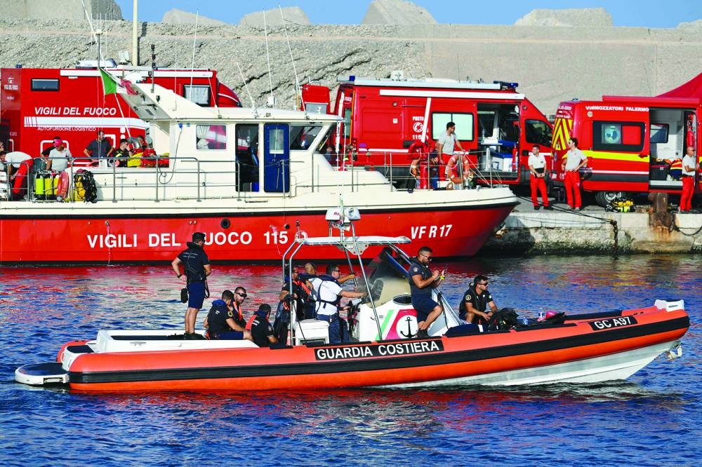 A rescue boat of the Italian Coast Guards operates in Porticello near Palermo, yesterday a day after the Bayesian sank. (AFP) 