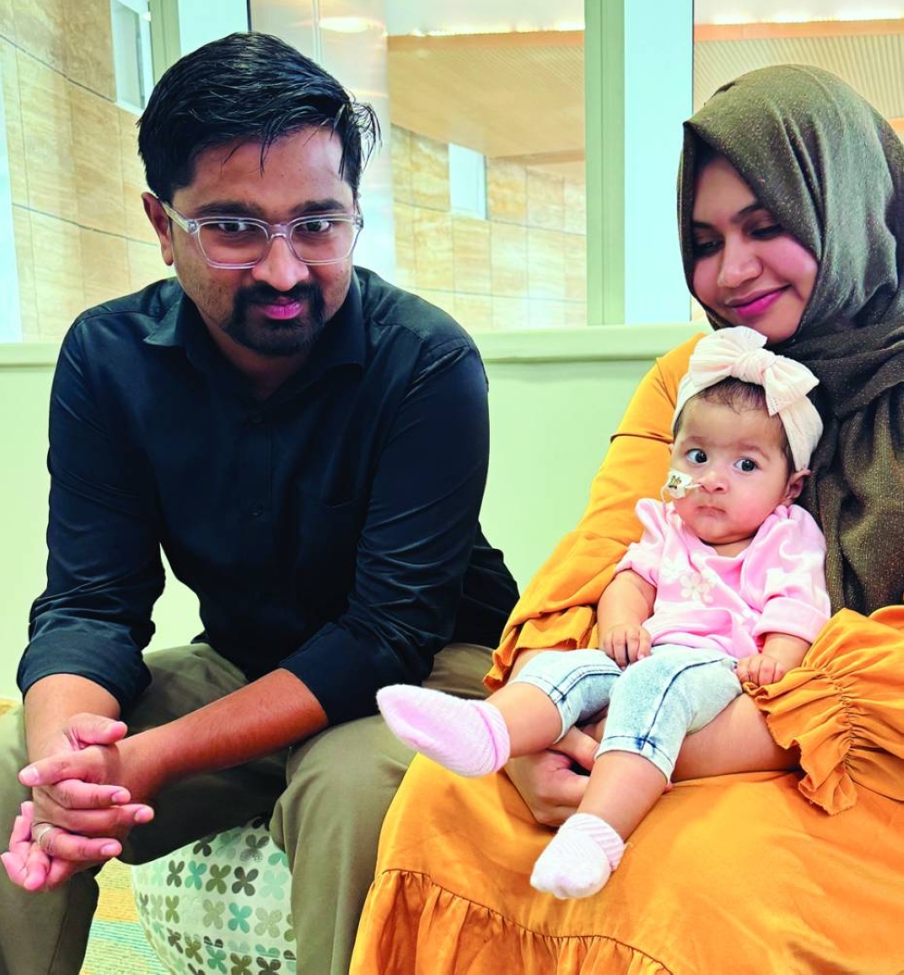Malkha Rouhi with her parents Risal Abdul Rasheed and Nihala Nizam (supplied picture).