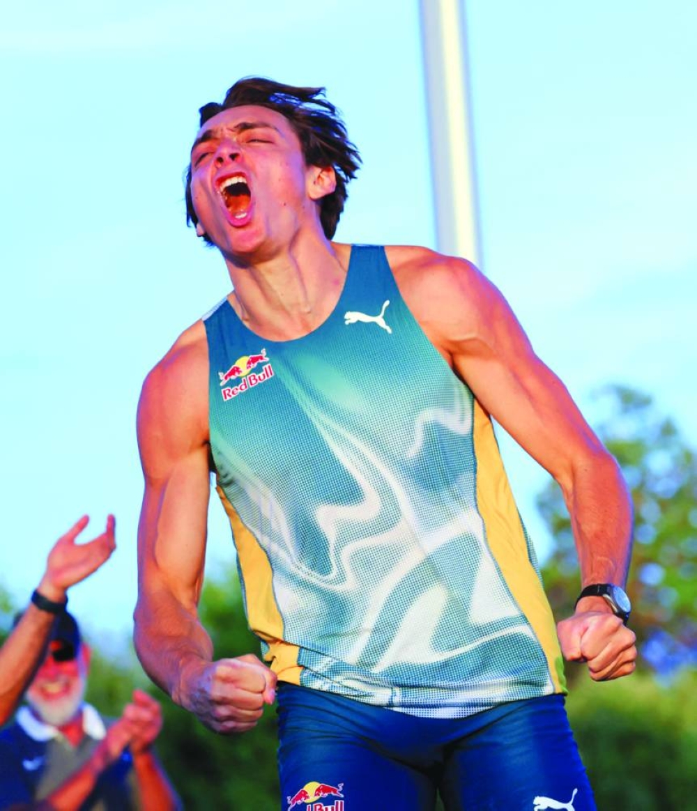 Sweden’s Armand Duplantis celebrates after clearing 6.15m in the Lausanne Diamond League pole vault event at the Place de la Navigation in Lausanne, Switzerland, on Wednesday. (Reuters)