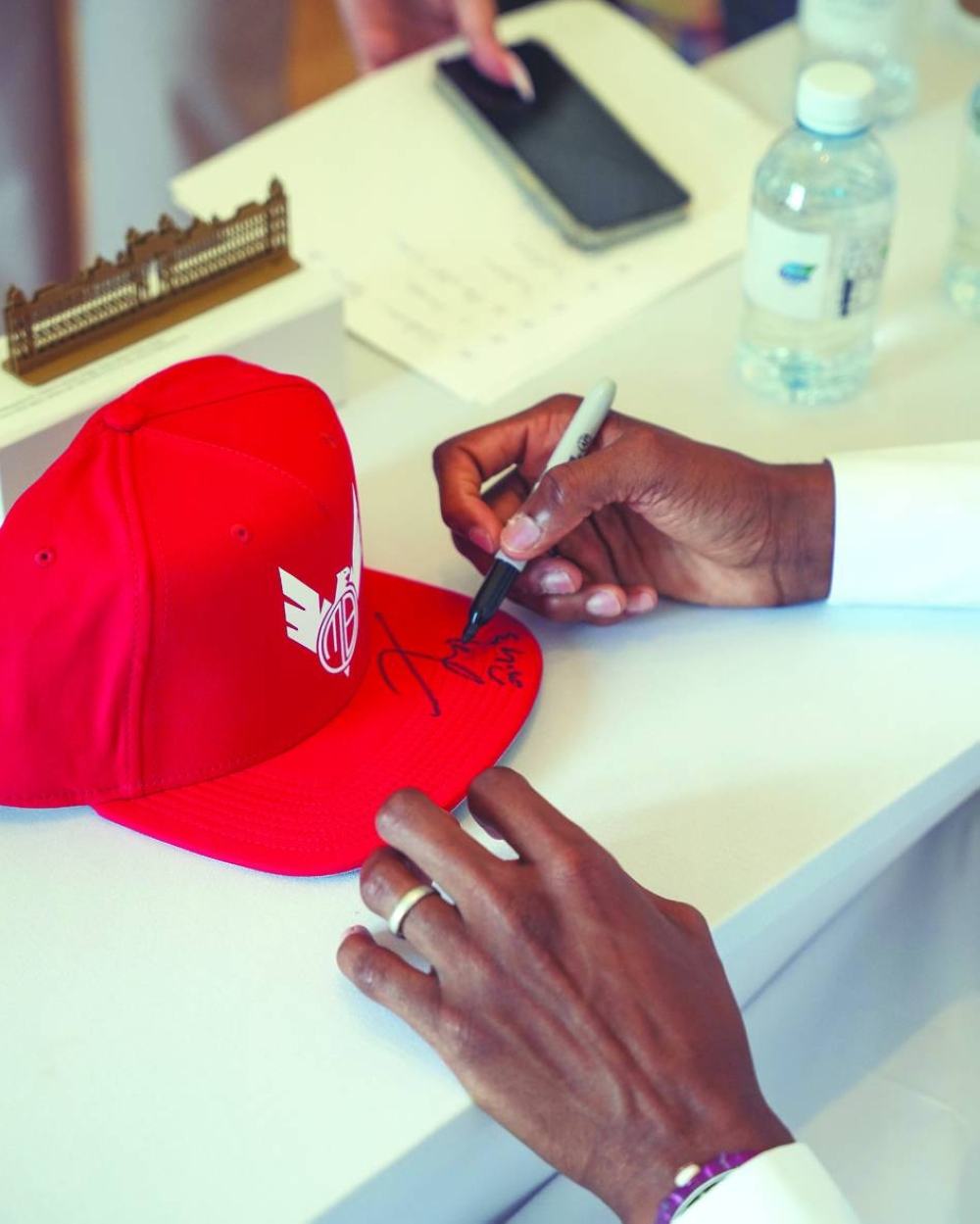 Mutaz Barshim signs autographs after the press conference in Doha on Thursday. 