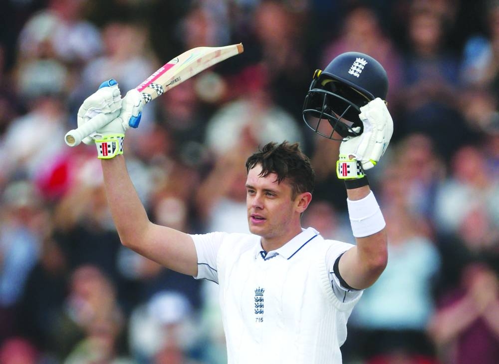 England’s wicketkeeper batsman Jamie Smith celebrates reaching his century on day three of the first Test against Sri Lanka at Old Trafford in Manchester on Friday. (Reuters)